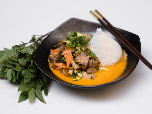 65. Thai curry duck cooked in a clay pot
